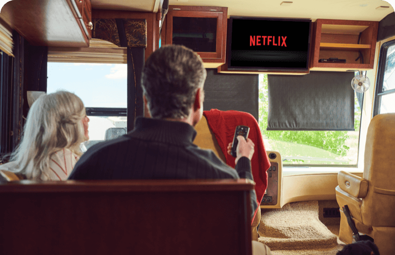 Couple in an RV watching television